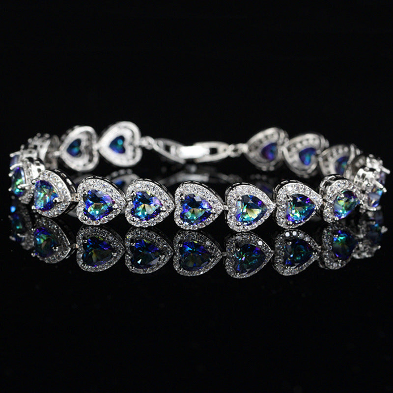 JLUXS Spectacular Ladies White Gold Rhodium Over Sterling Silver Created Blue Mystic Topaz Bracelet