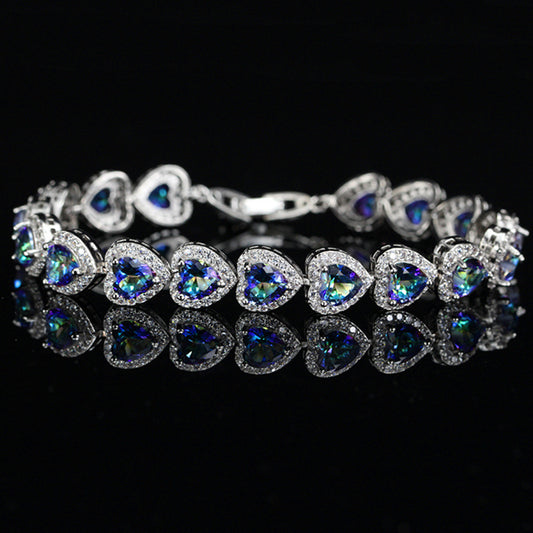 JLUXS Spectacular Ladies White Gold Rhodium Over Sterling Silver Created Blue Mystic Topaz Bracelet